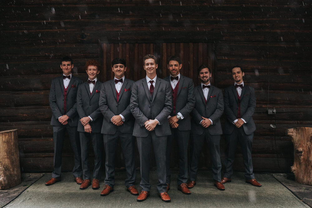I was also able to make the most of the rain by using the lodge’s awning entrance. This photo of the groom and his groomsmen show just how much rain was coming down that day! Don’t worry though, they all stayed dry!