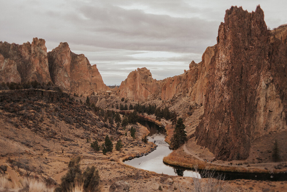 Pictured here is the canyon and winding river among the tall rock formations of Smith Rock State Park. This view can be seen in some variation from the parking lot of the park.
