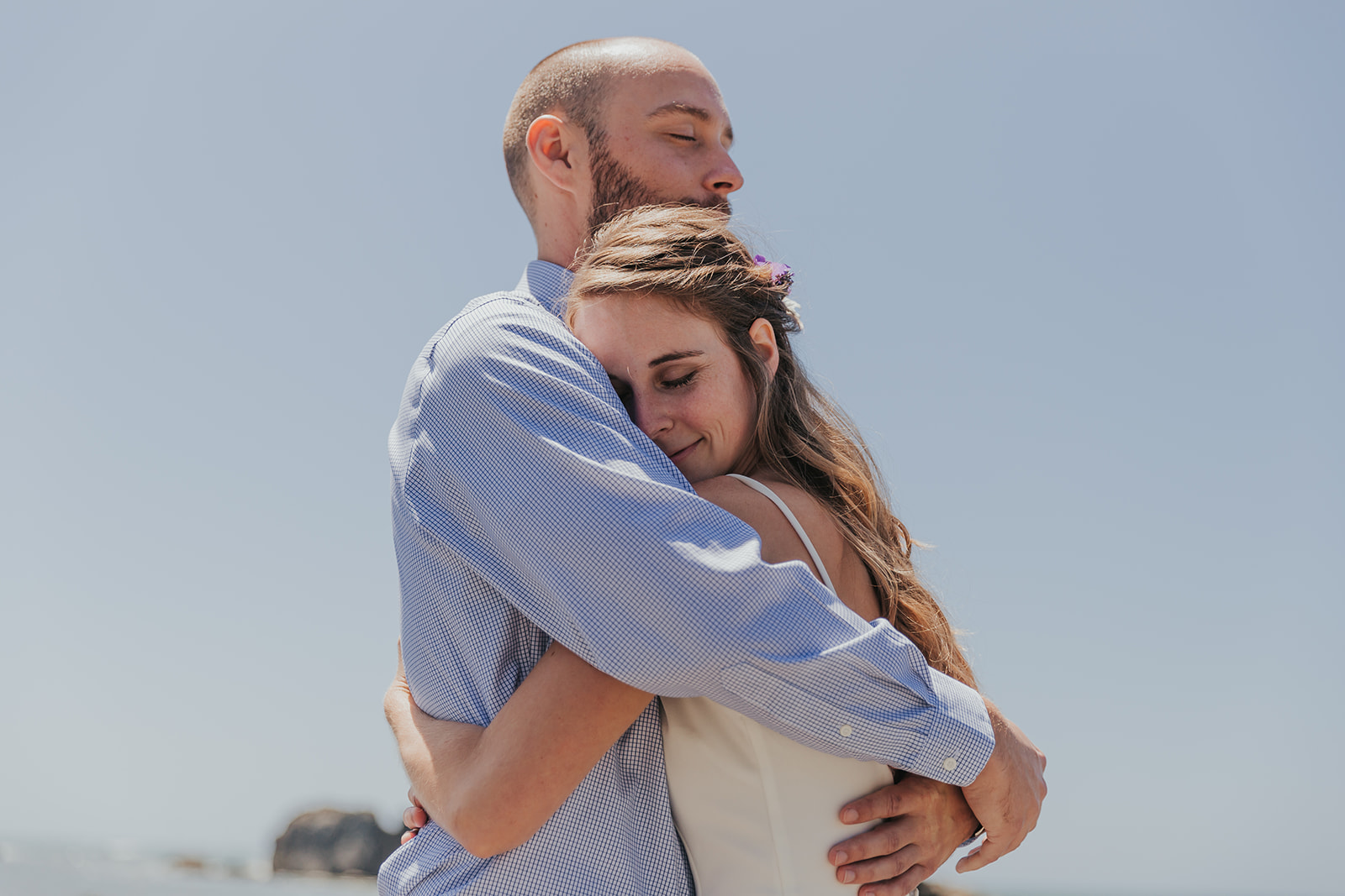 A couple hug and embrace on their elopement day