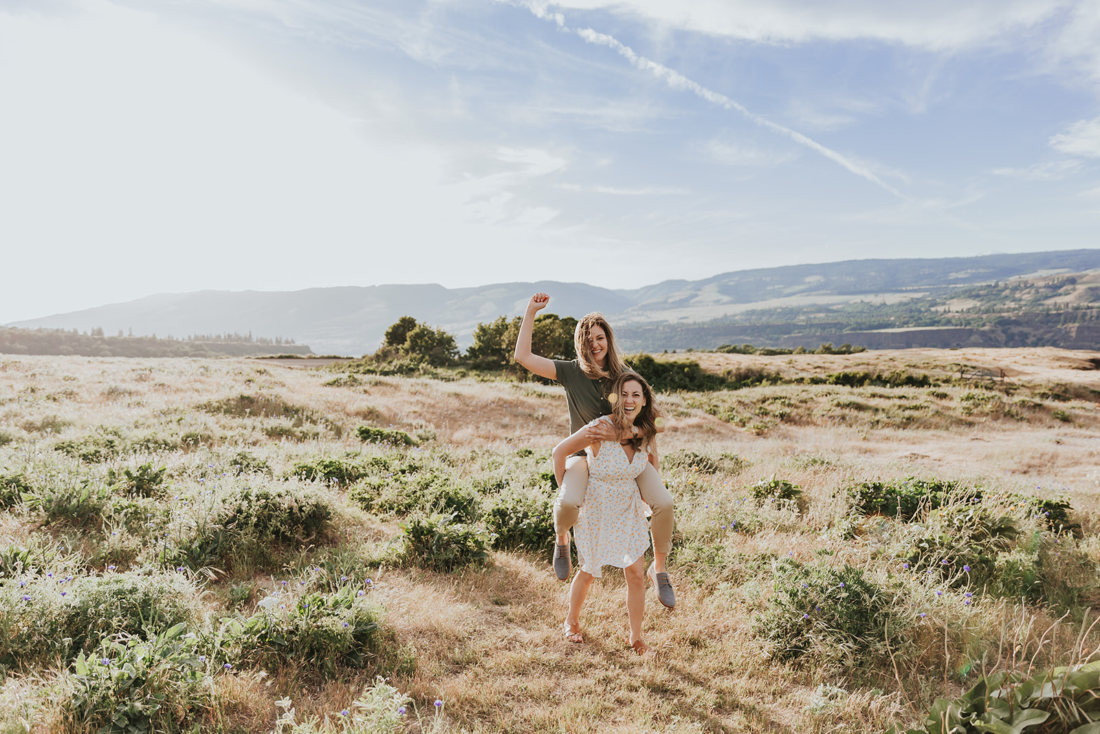 A couple dances in the fields of the Rowena Crest in the Columbia River Gorge.