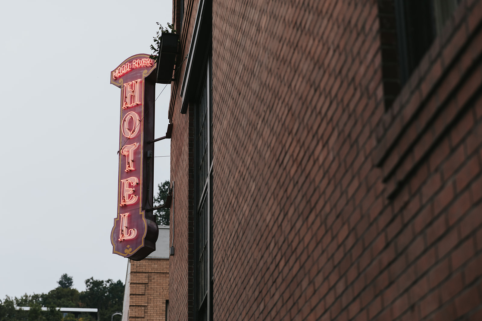 The exterior sign of the Hood River Hotel.